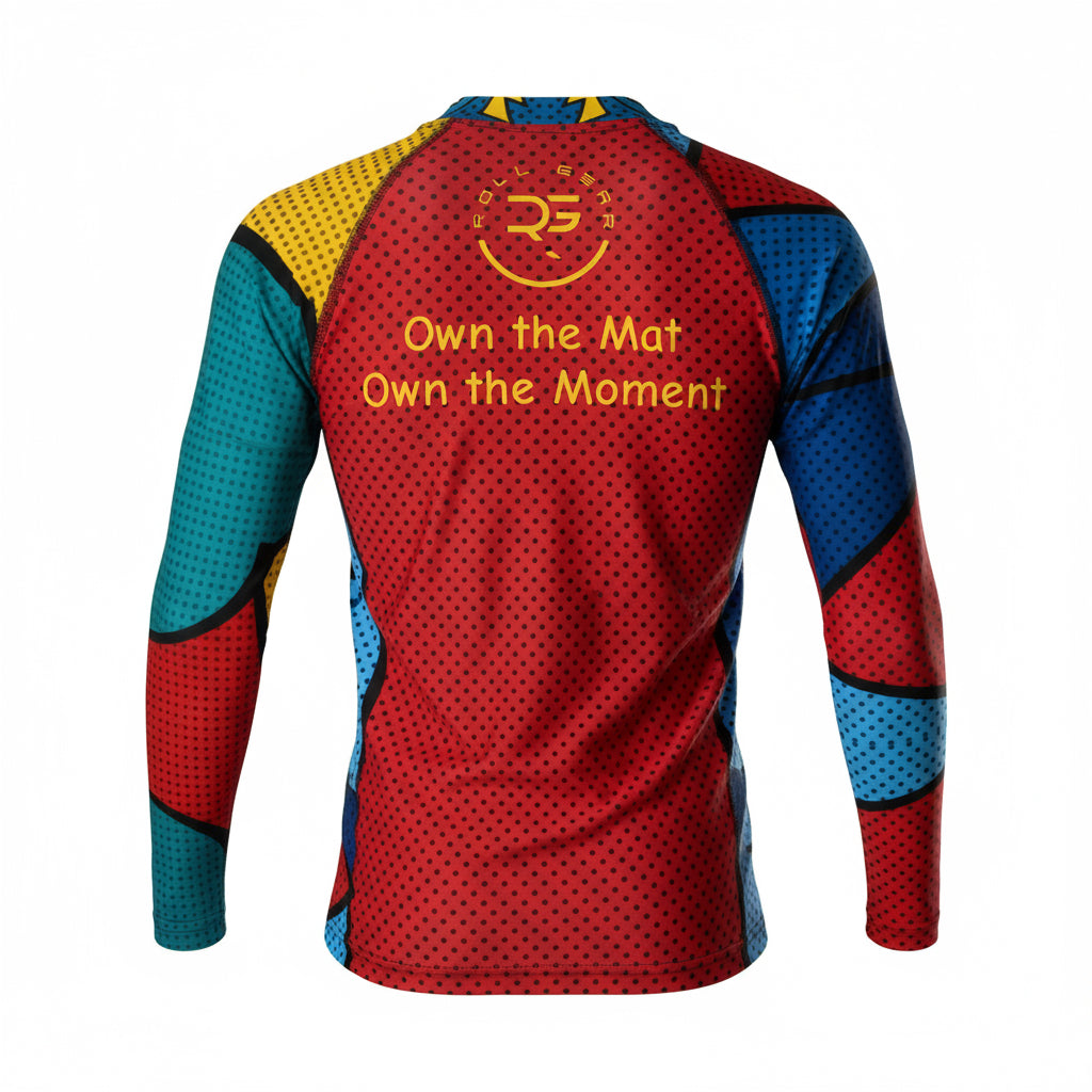 Kids long-sleeve rash guard with vibrant comic pop art design featuring bold red, blue, yellow, and teal color blocks, comic-style graphics, and text bubbles saying POP! and WOW MOM. Unisex limited edition training gear for boys and girls in BJJ, wrestling, and MMA.” Roll gear