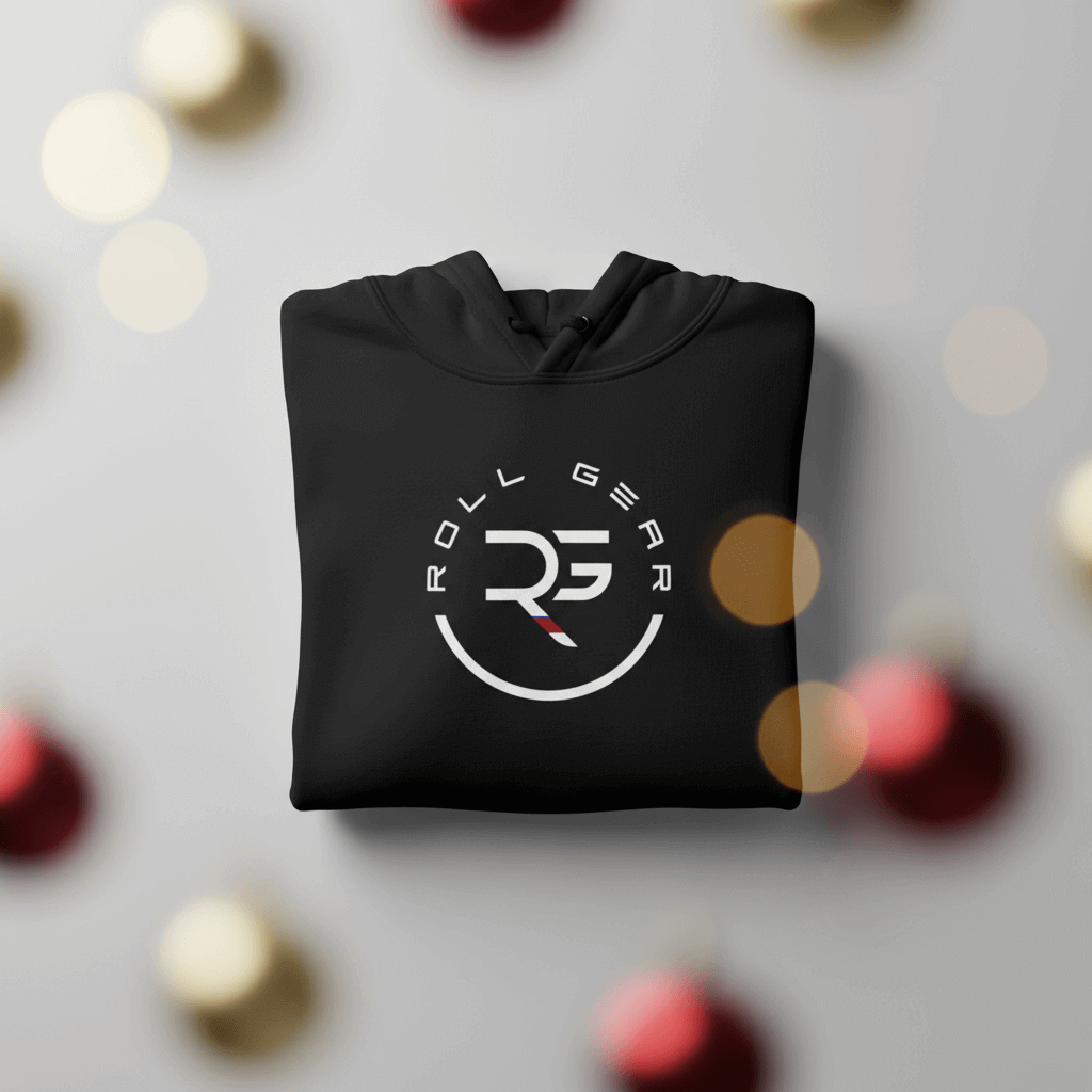 Folded black hoodie with 'Roll Gear' logo on a blurred background