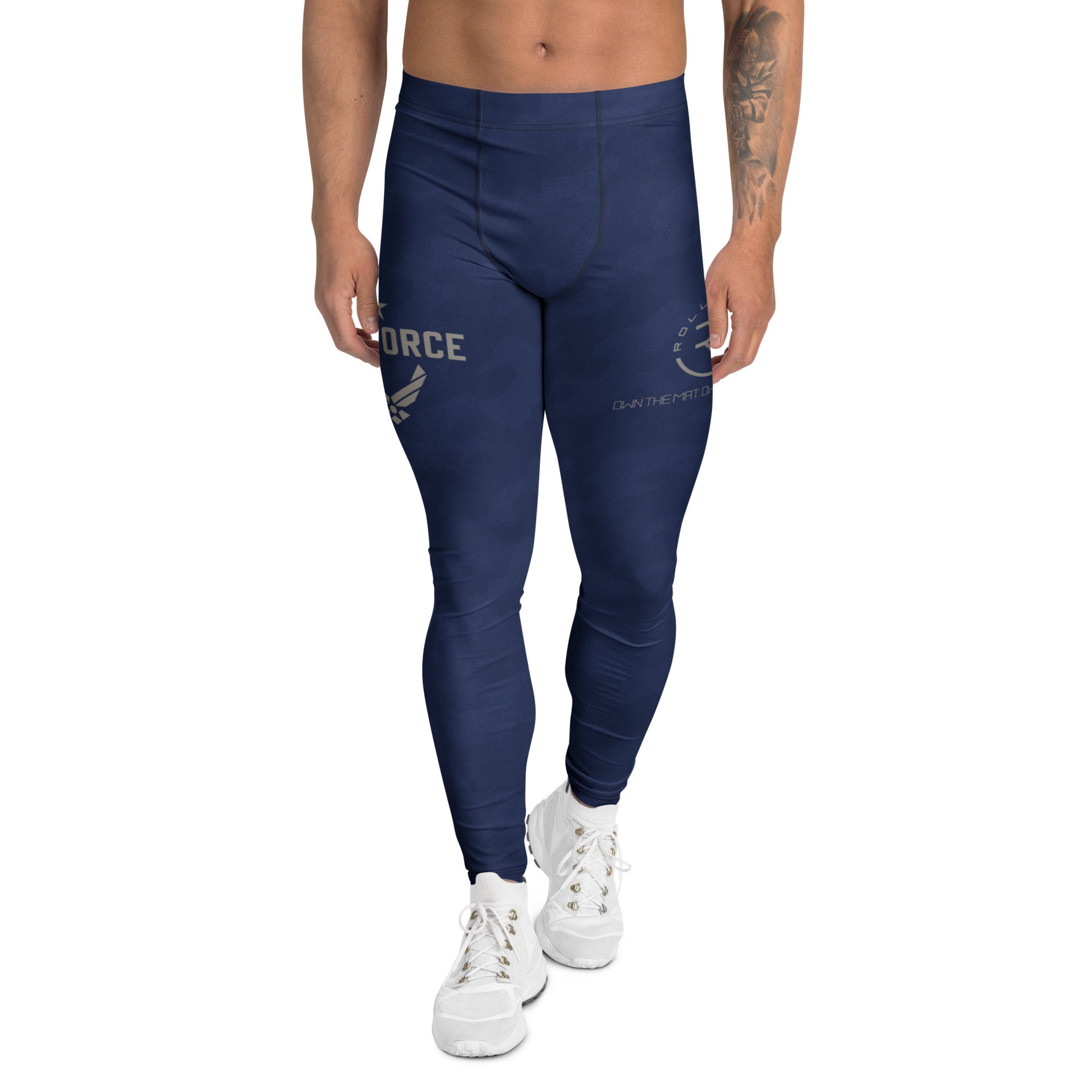 Person wearing blue leggings with branding on a white background