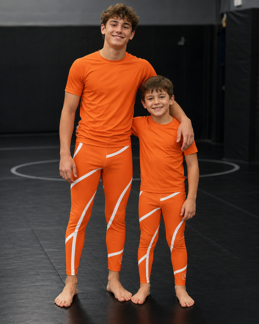 Orange Swirl Spats – Orange/White – Youth | Roll Gear
