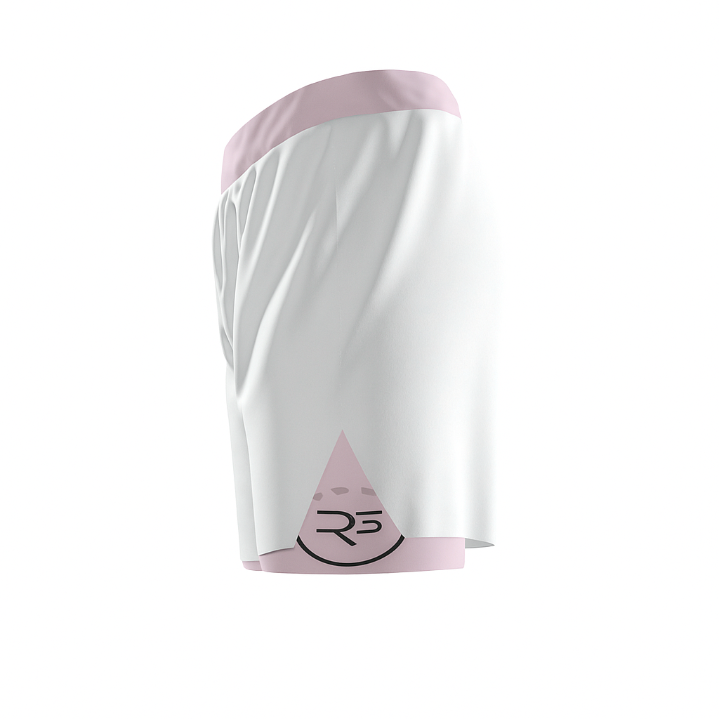 Side view of Roll Gear girls’ 2-in-1 athletic shorts with pink waistband and hem, showing logo triangle patch on the lower leg.
