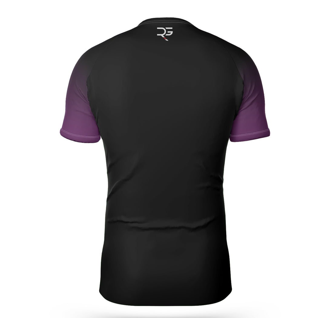 Backside of purple belt ranked BJJ rash guard, showcasing purple shoulder panel and sleek black compression fit. Engineered for high-performance jiu-jitsu training and competition wear, with flatlock stitching and subtle Roll Gear logo.