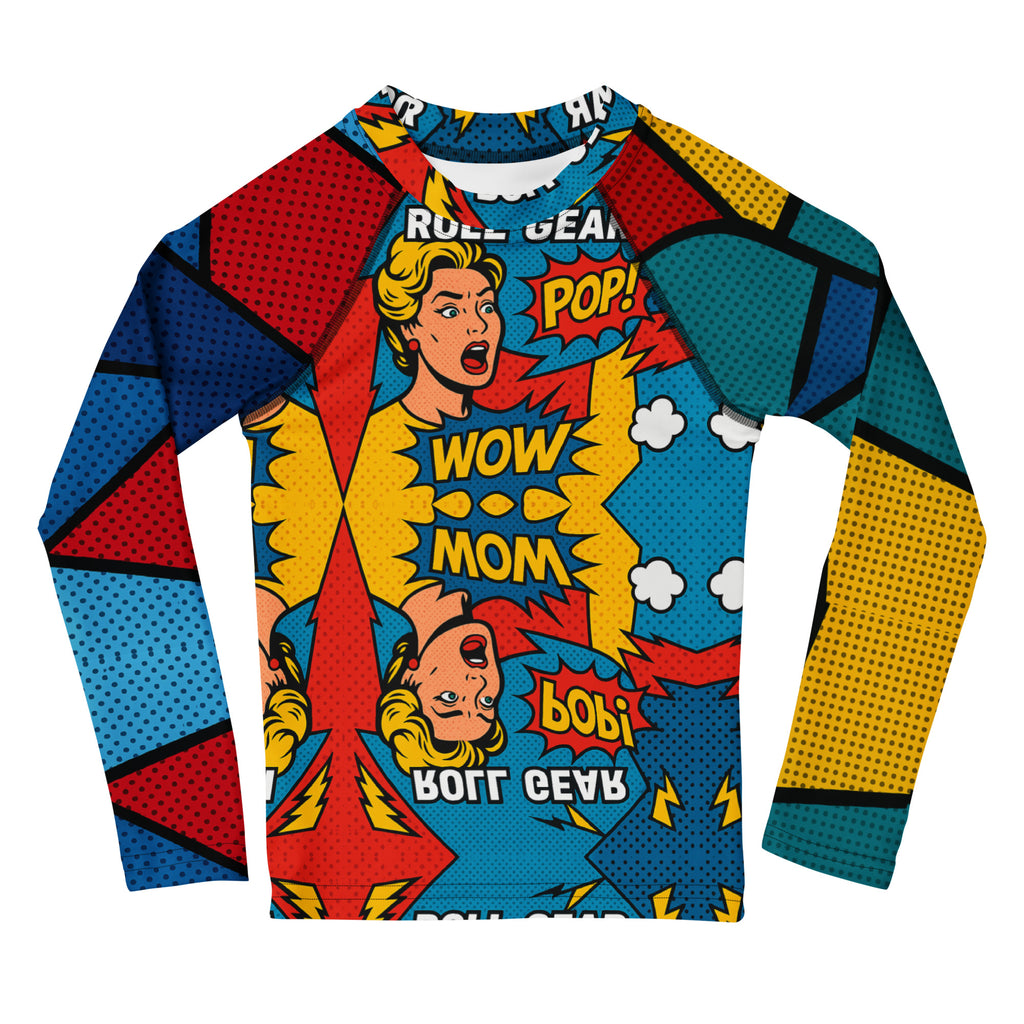 Kids long-sleeve rash guard with vibrant comic pop art design featuring bold red, blue, yellow, and teal color blocks, comic-style graphics, and text bubbles saying POP! and WOW MOM. Unisex limited edition training gear for boys and girls in BJJ, wrestling, and MMA.”
