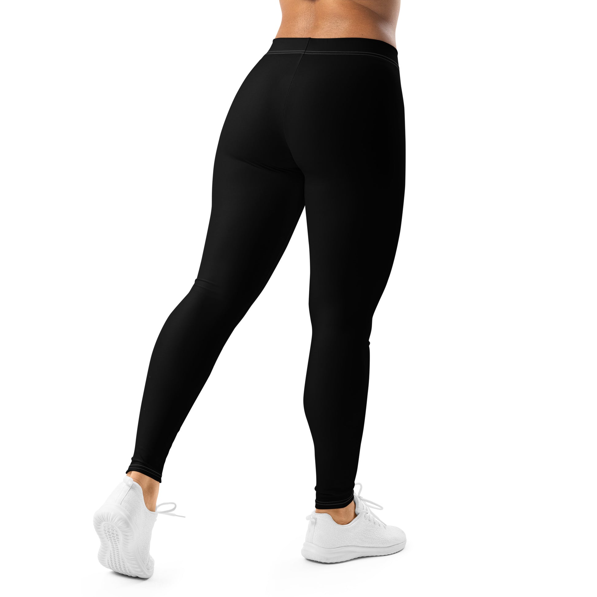 Person wearing black leggings on a white background
