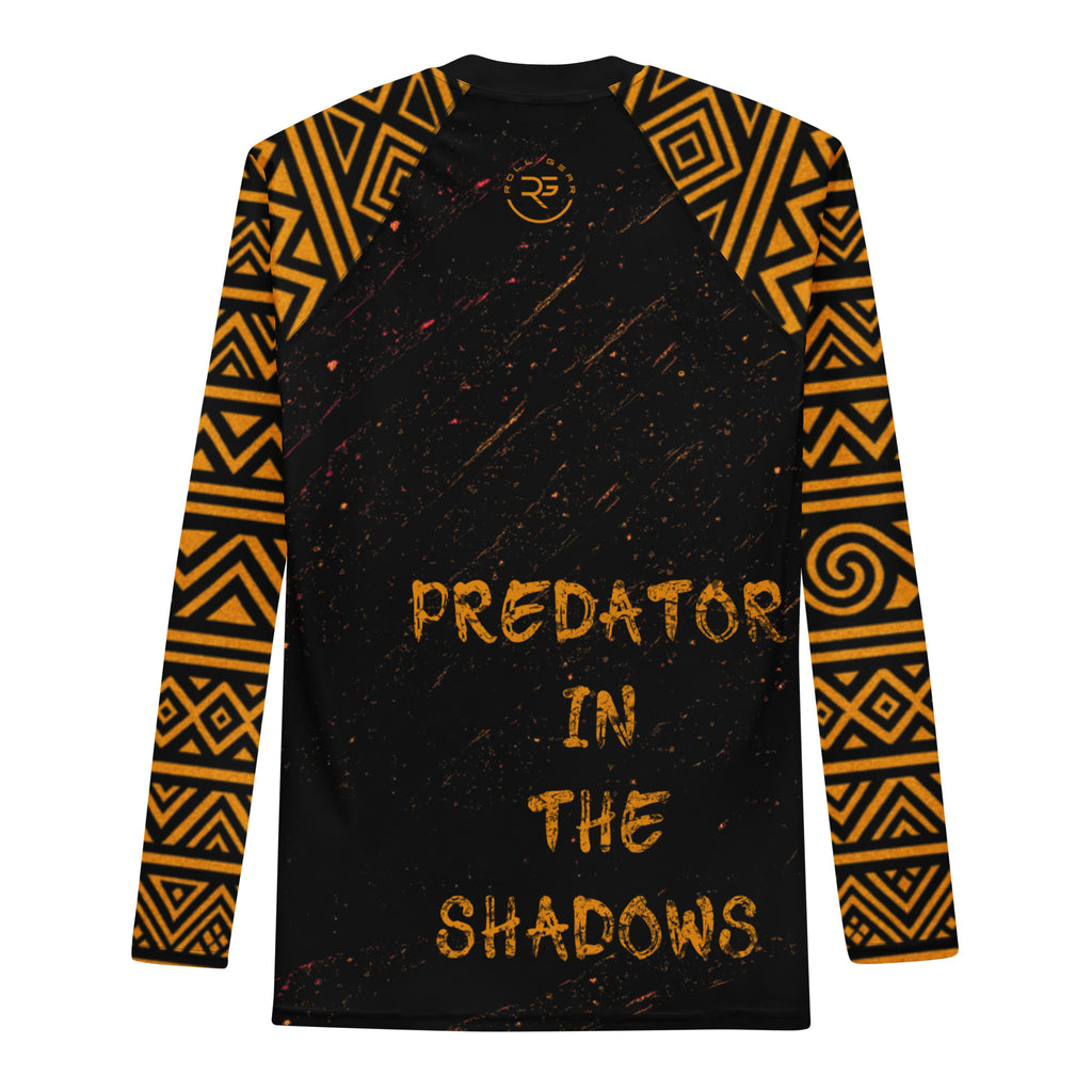 Black long-sleeve shirt with orange geometric patterns and 'Predator in the Shadows' text on a white background