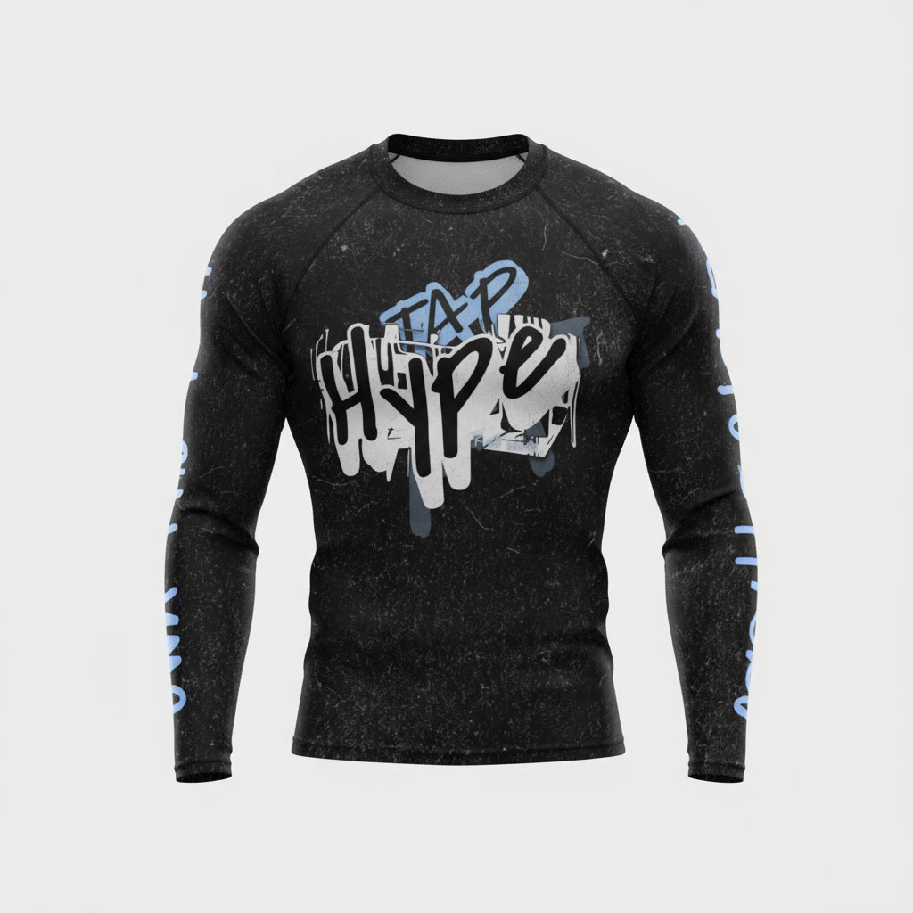 Black long-sleeve shirt with graphic design on a gray background