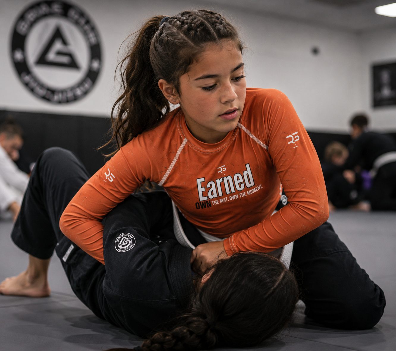Earned Not Given Long Sleeve Rash Guard – Burnt Orange – Kids | Roll Gear