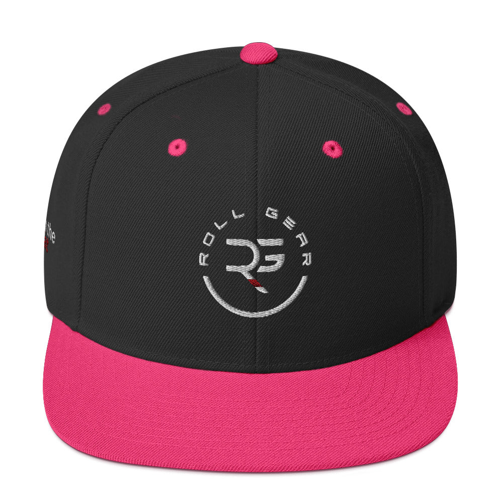Roll Gear snapback with pink brim – front view, structured high-profile cap with embroidered RG logo