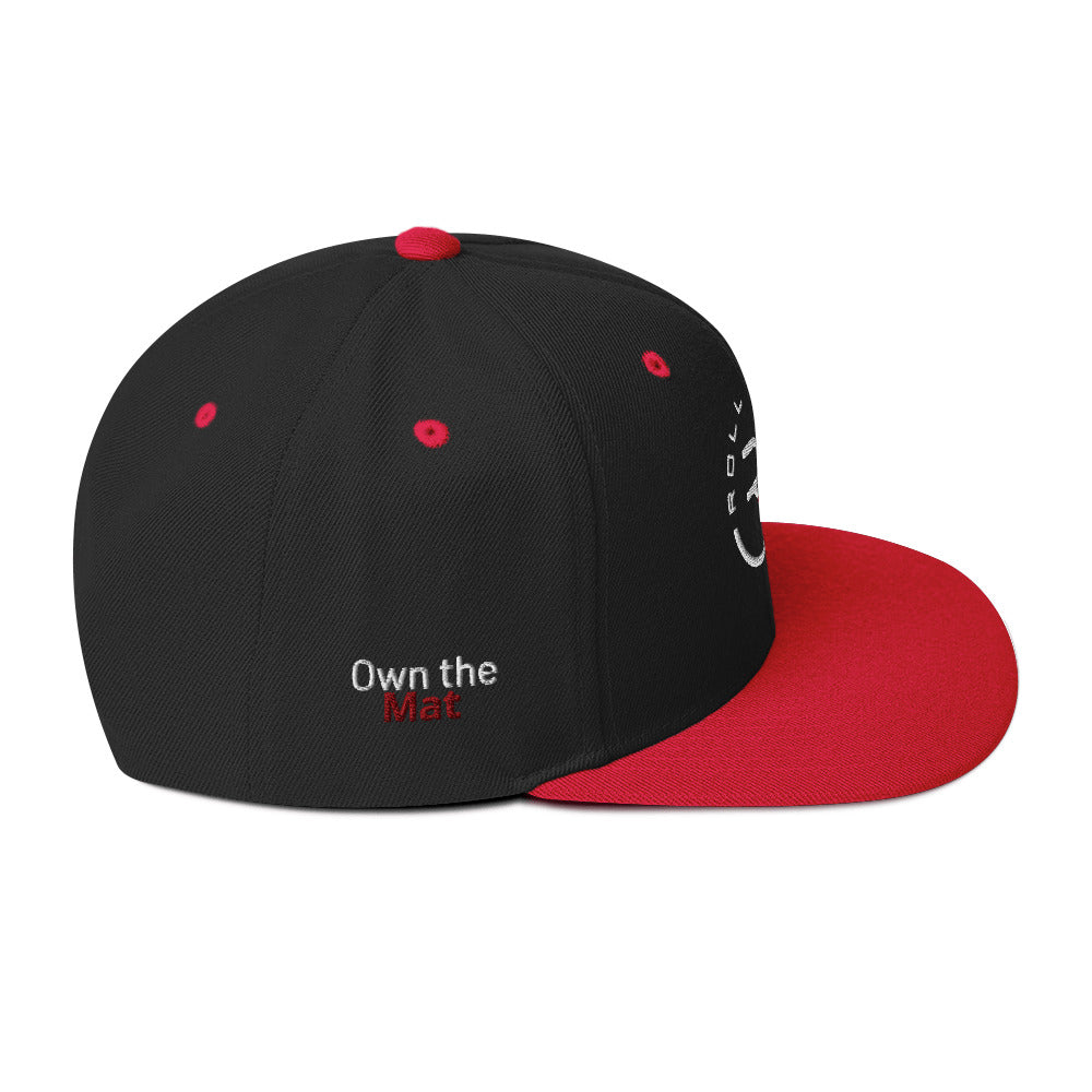 Roll Gear structured snapback hat – laid flat to show full panel design, logo embroidery, and brim detail
