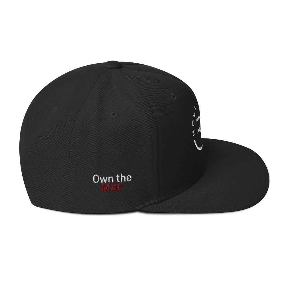 Roll Gear structured snapback hat – laid flat to show full panel design, logo embroidery, and brim detail