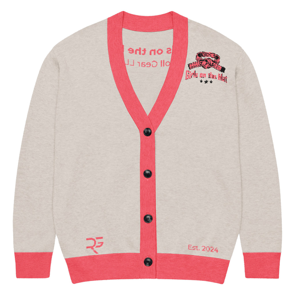 Cardigan with red trim and black buttons on a white background