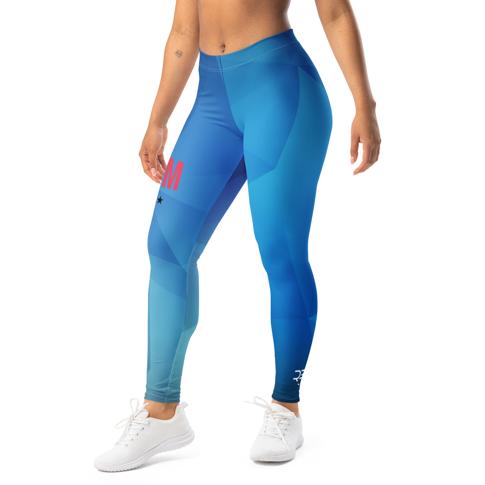 Blue leggings with a pink logo worn by a person on a white background