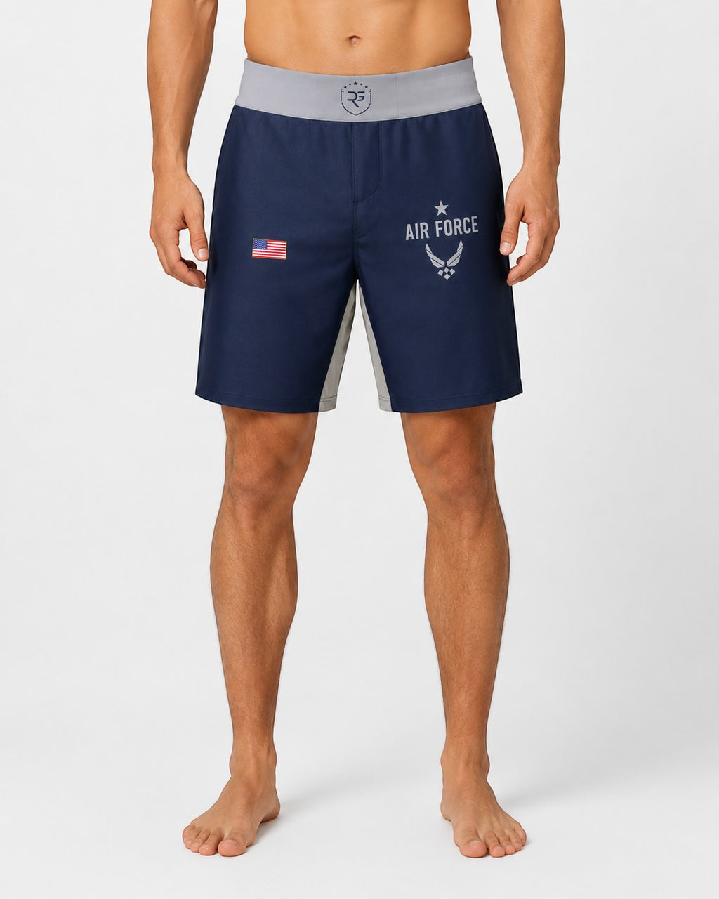 Roll Gear Air Force grappling shorts in navy blue with grey side panels and US flag detail. Features Air Force logo and text.