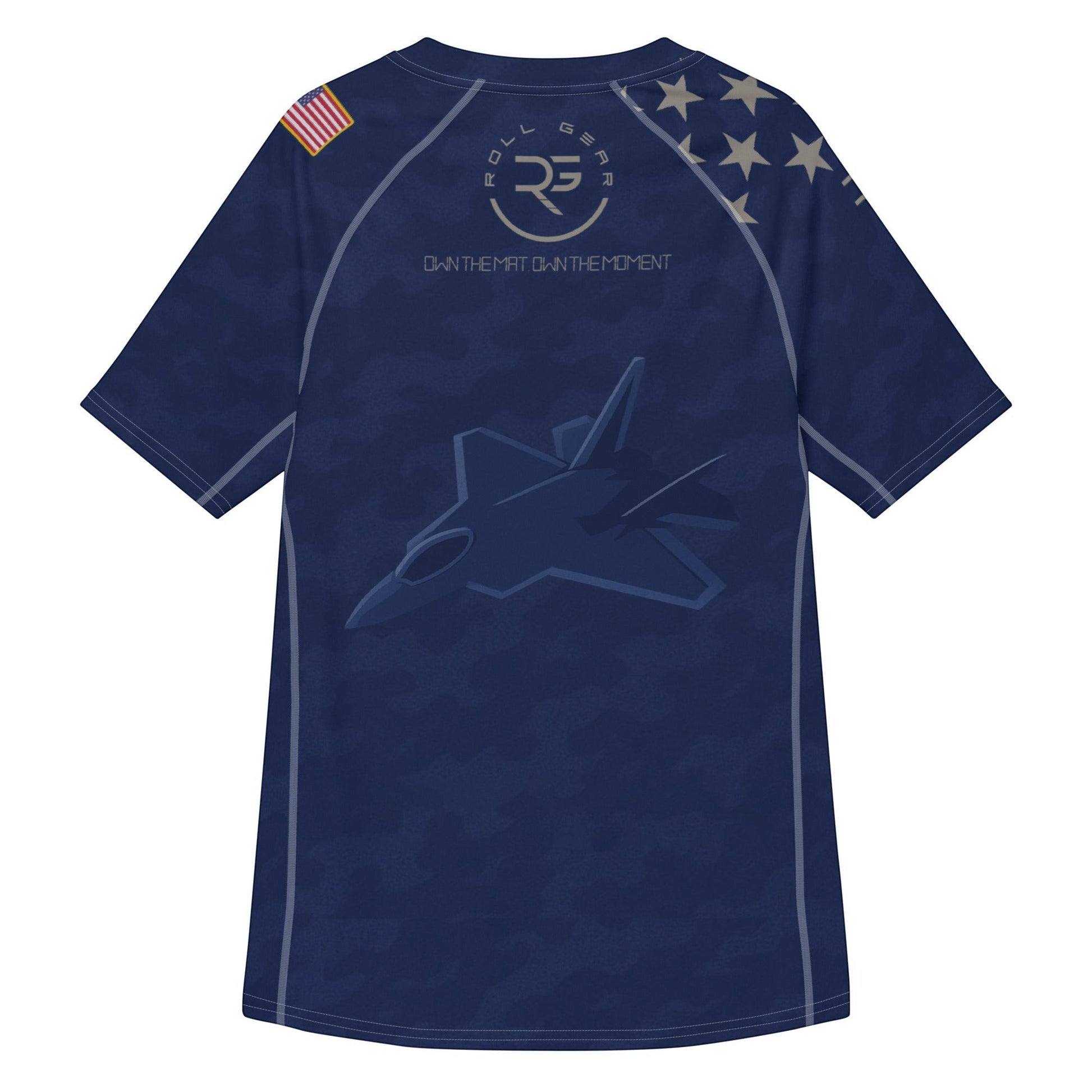 Roll Gear Unisex Air Force short sleeve rash guard in navy blue with camouflage print, jet graphic, and US flag detail.