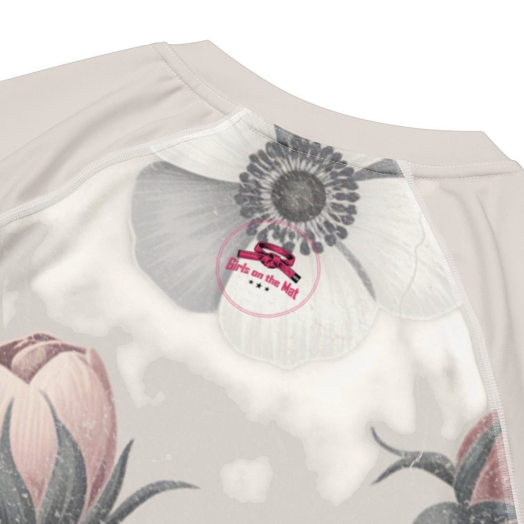 Roll Gear Always Blooming women's short sleeve rash guard with floral print and UPF 50+ protection.