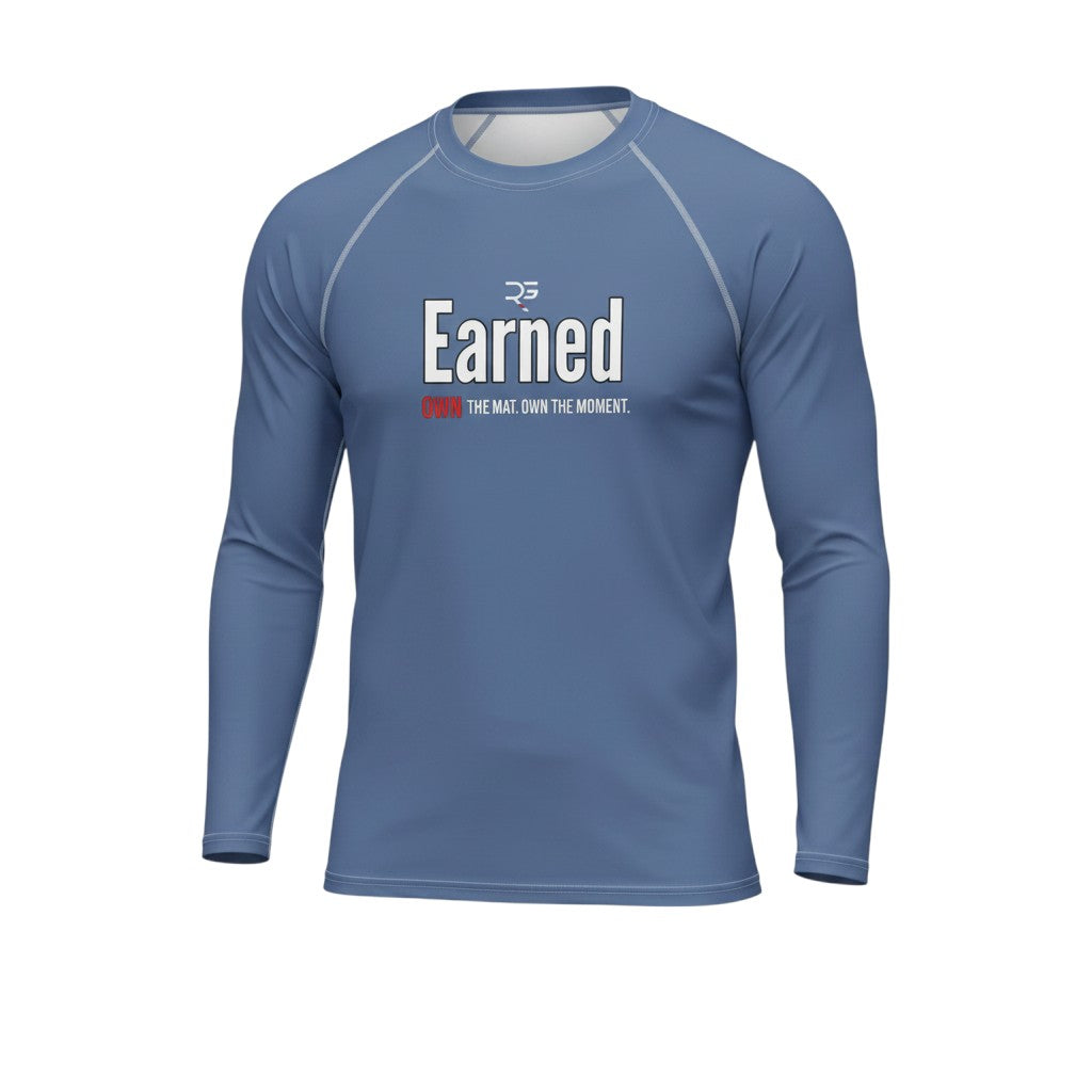 Roll Gear blue long sleeve performance rash guard with "Earned Not Given" graphic on chest. Moisture-wicking, stretch fabric for training.