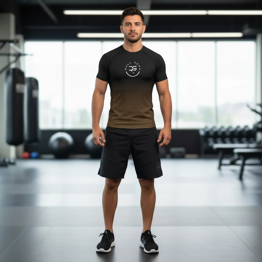 Roll Gear adult short sleeve rash guard with black to brown gradient fade and signature chest emblem.