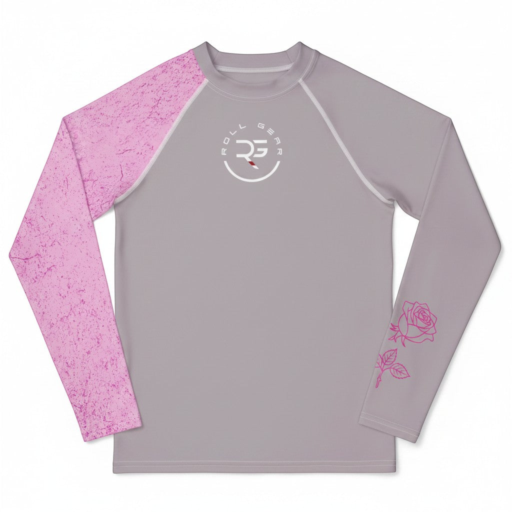 Roll Gear grey long sleeve youth performance rash guard with pink textured sleeves and rose graphic on right sleeve.