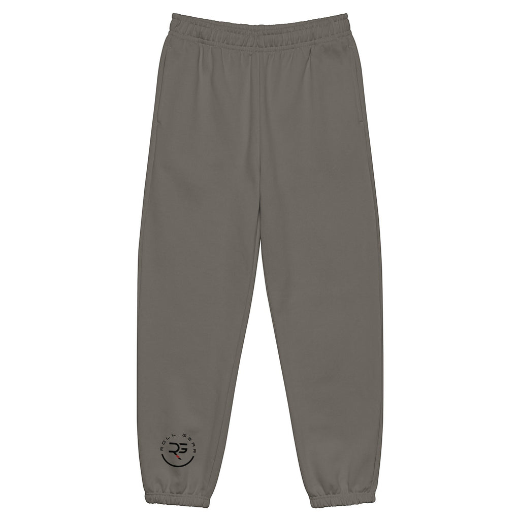 Roll Gear™ heavyweight grey cotton-poly fleece joggers with elastic cuffs and subtle logo detail near the ankle.
