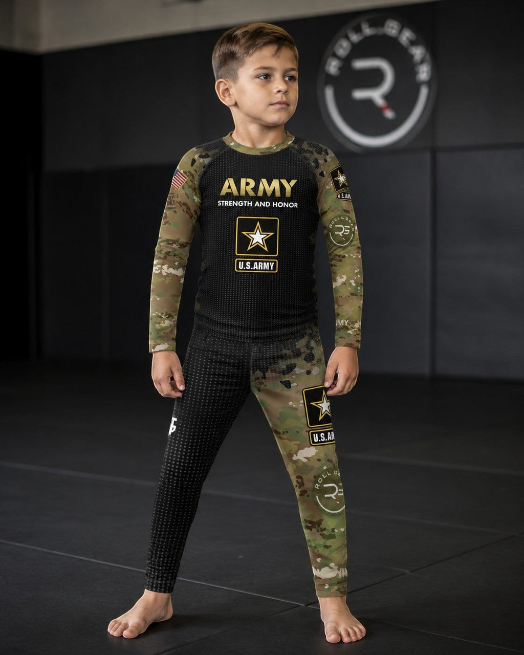 Roll Gear Kids Army Long Sleeve Rash Guard with black body, Multicam sleeves, and U.S. Army insignia. Performance fabric for BJJ, wrestling, MMA.