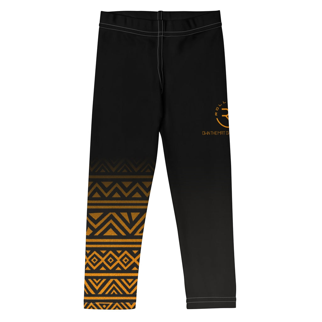 Roll Gear kids black and gold Lion's Pride spats with tribal pattern on leg. Moisture-wicking performance fabric.