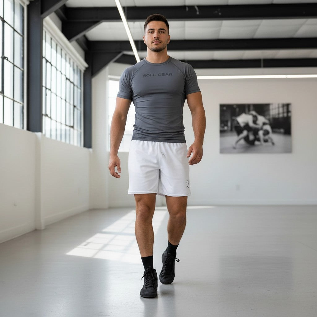 Roll Gear men's all-white mesh training shorts made from recycled polyester with an elastic waistband and UPF50+ protection.