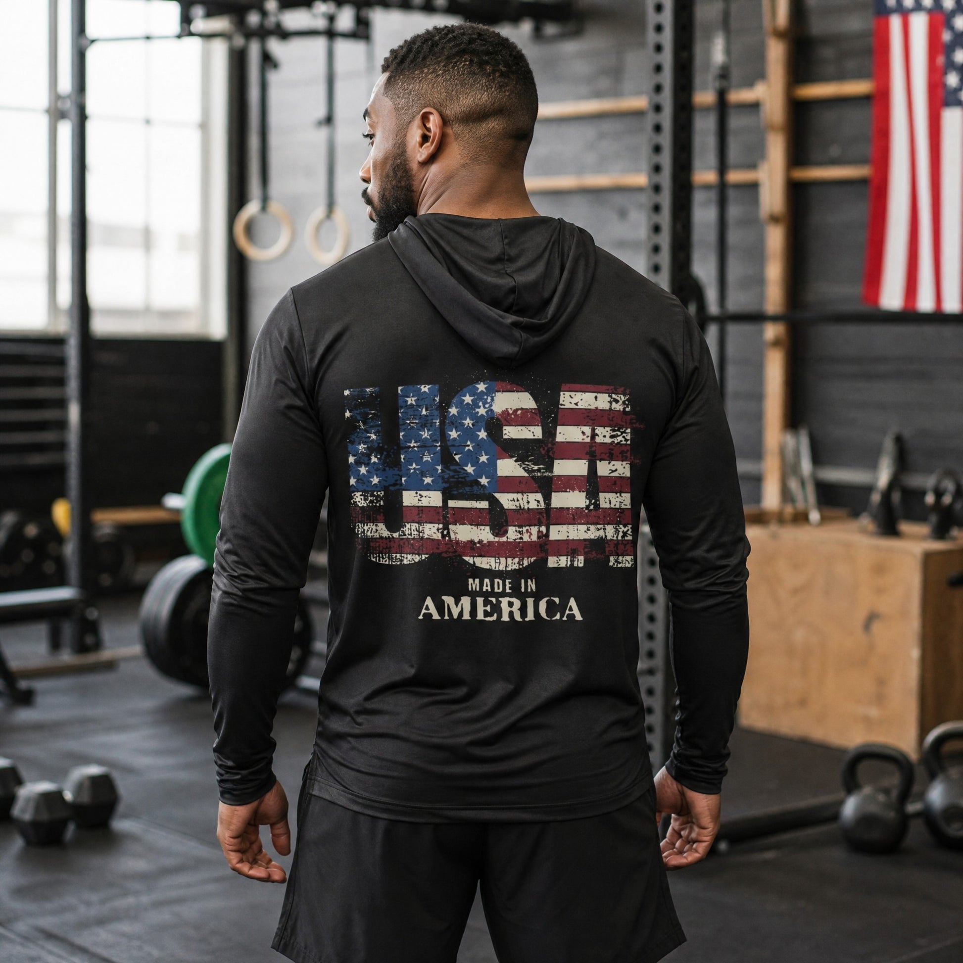 Roll Gear black hooded long sleeve shirt with distressed USA flag graphic and "MADE IN AMERICA" text.