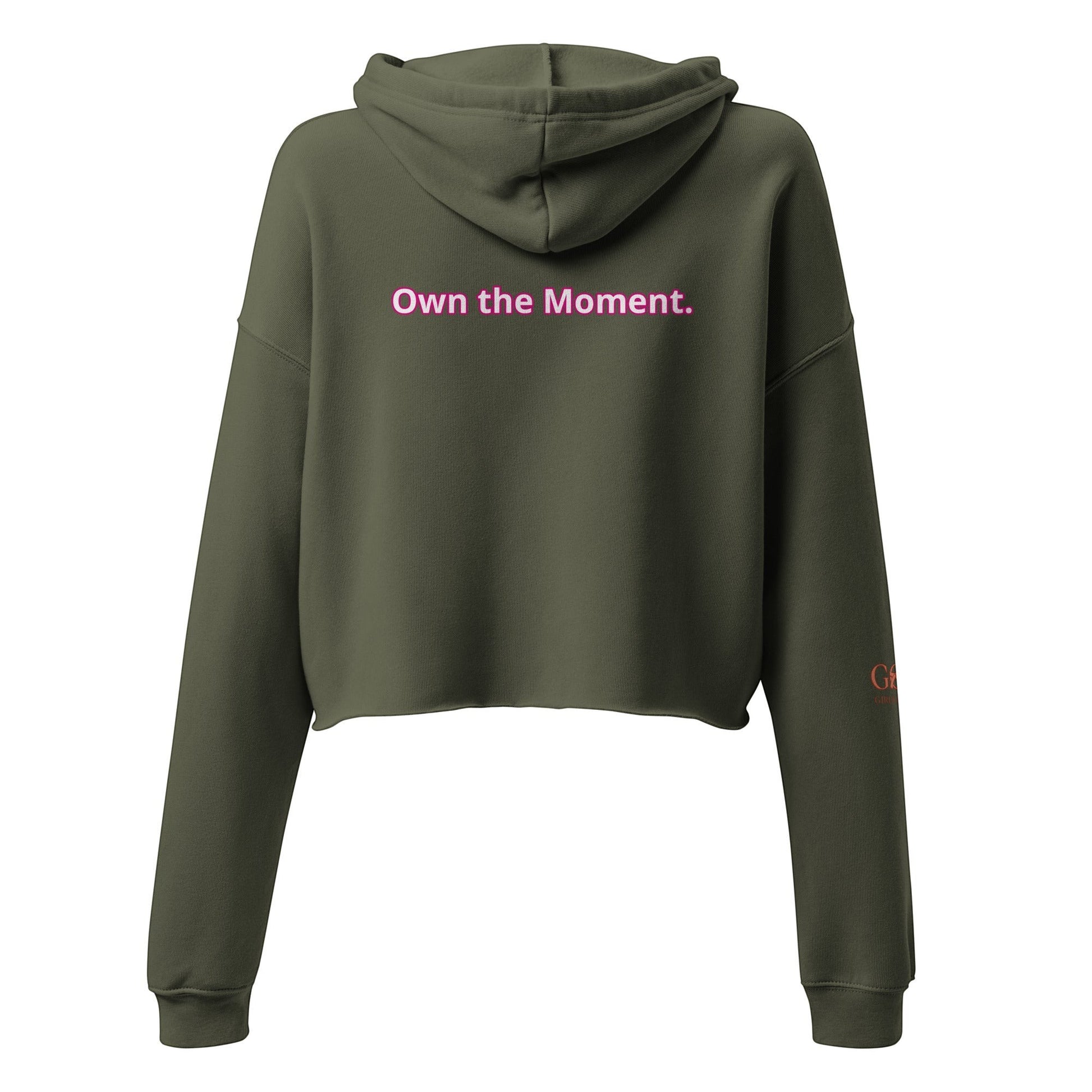 Roll Gear women's olive green cropped hoodie with pink text 'Own the Moment' on back.