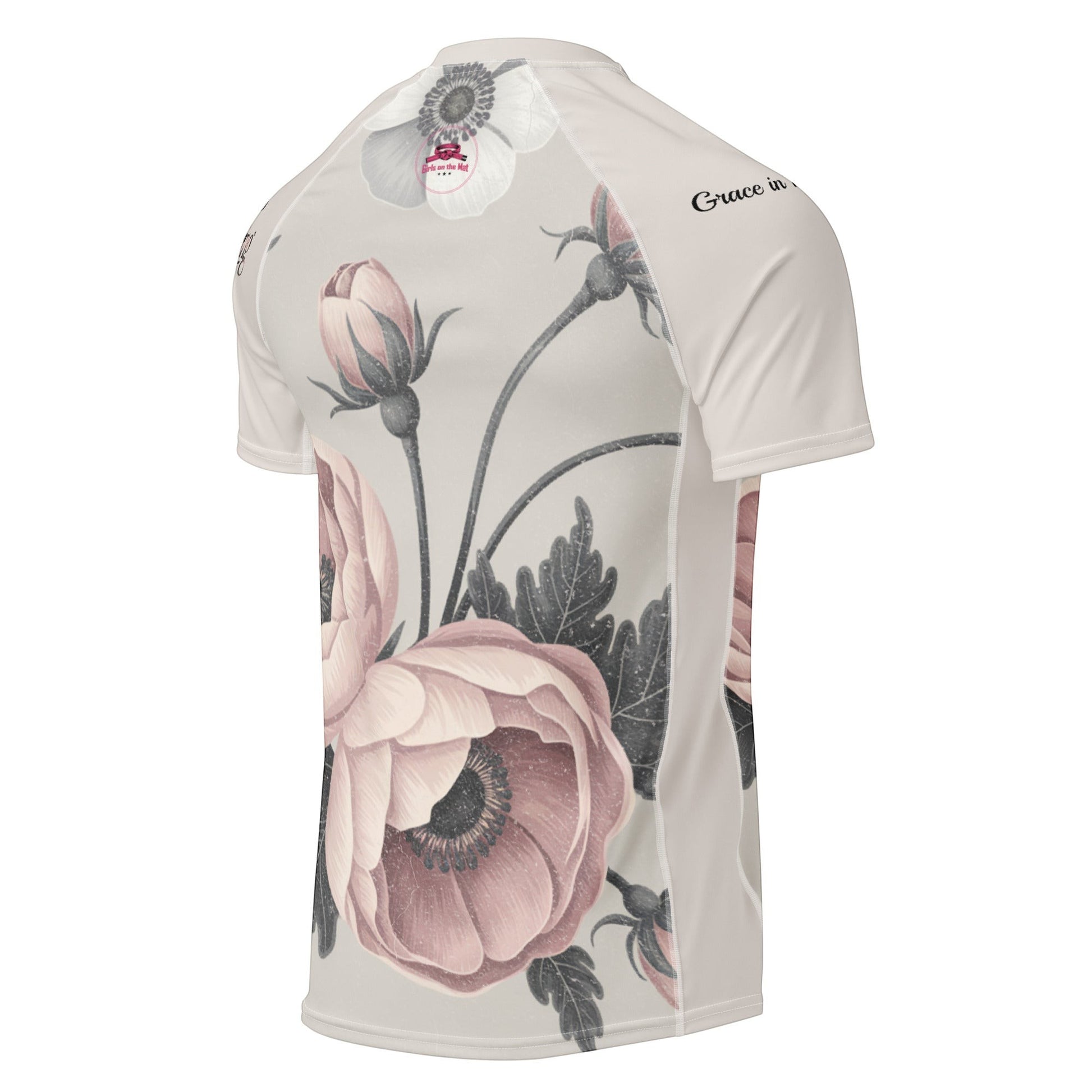 Roll Gear women's short sleeve rash guard with a vintage floral print in pink and grey on a cream background. Features UPF 50+ protection.