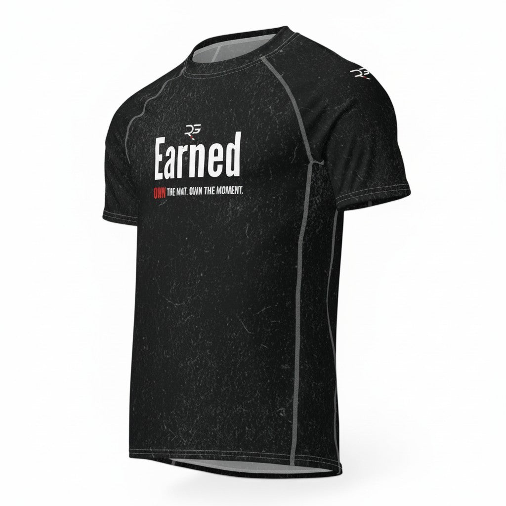 Roll Gear black short sleeve rash guard with "Earned Not Given" graphic. Moisture-wicking, 4-way stretch fabric for BJJ, wrestling, and training.