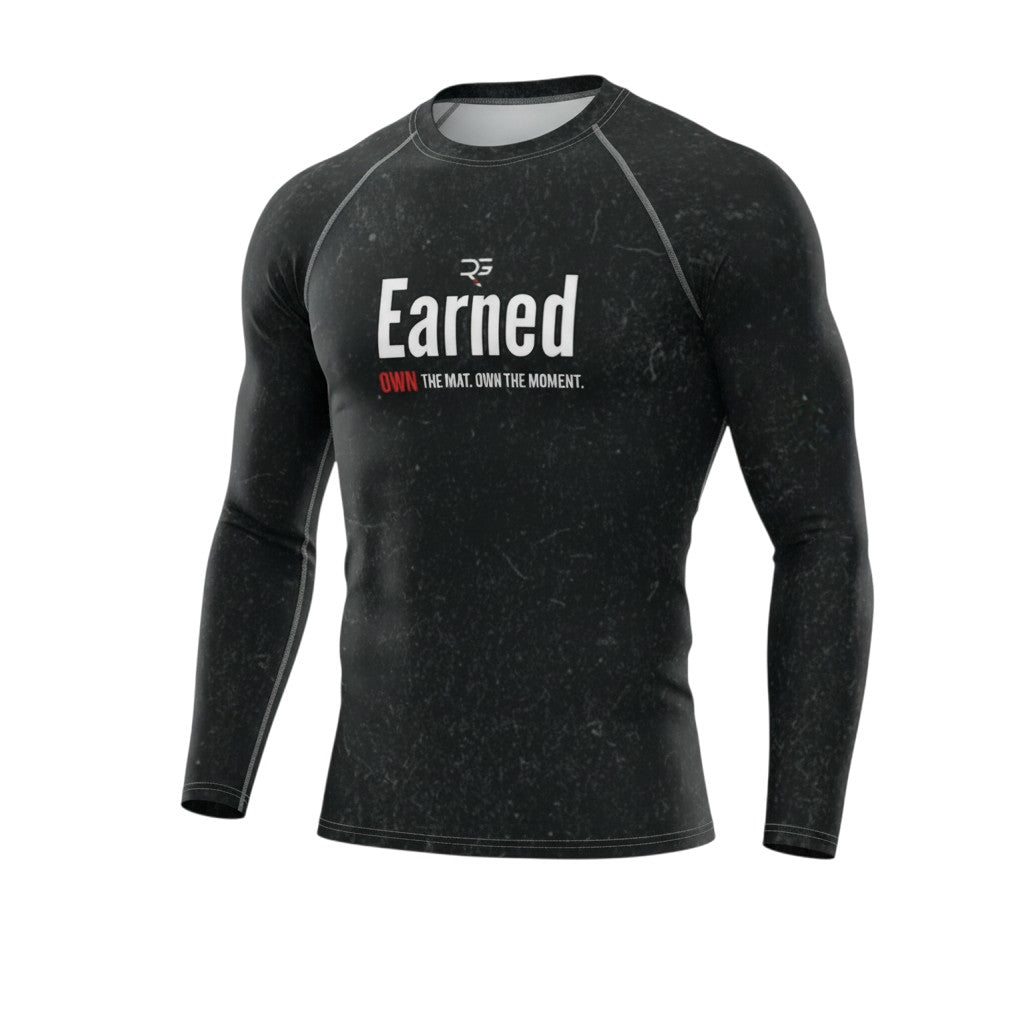 Roll Gear men's black long sleeve rash guard with 'Earned Not Given' graphic. Moisture-wicking, compression fit for training.
