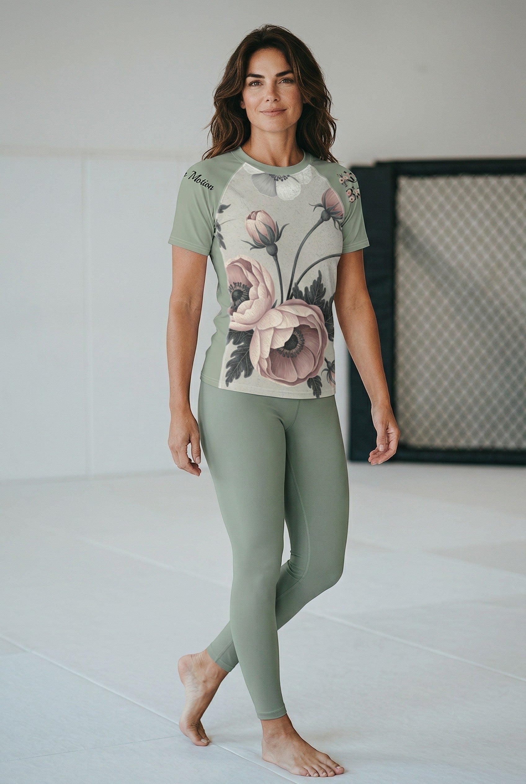 Roll Gear Always Blooming rash guard in sage green with floral print, short sleeves, athletic fit for women.