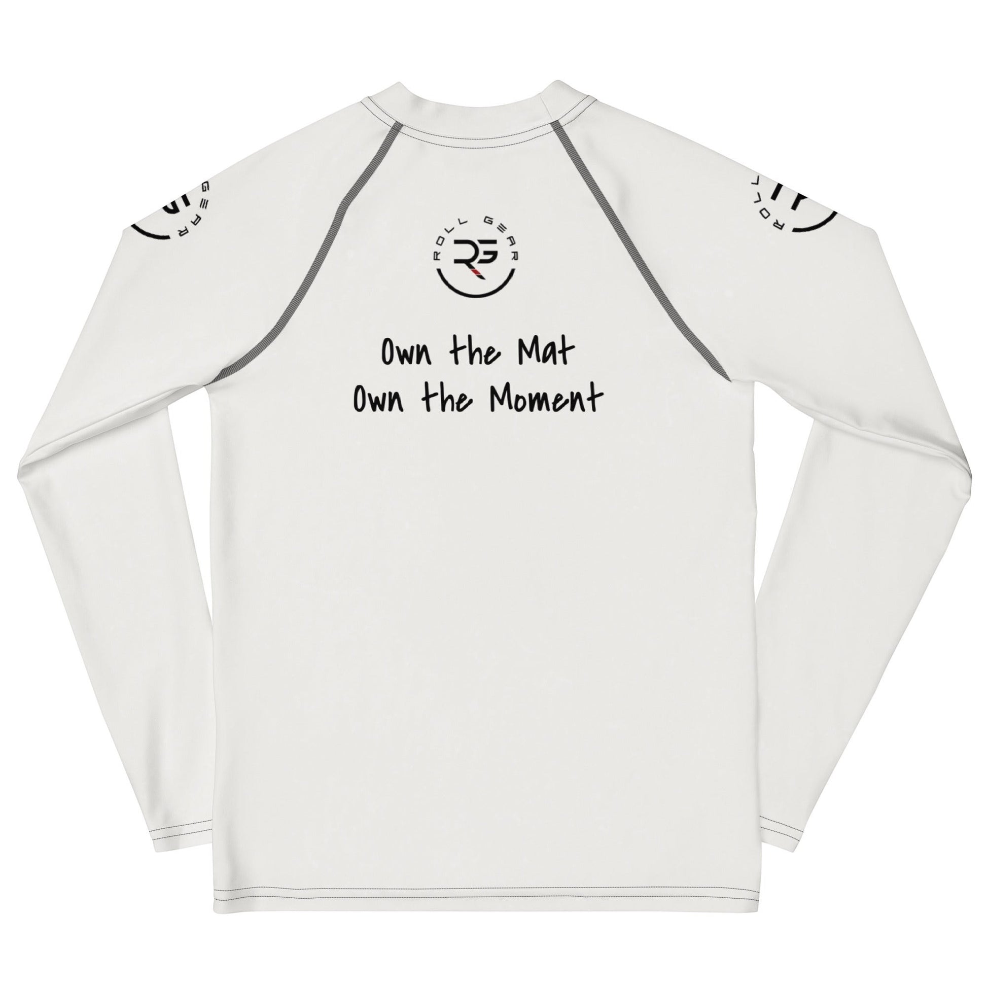 Roll Gear white long sleeve performance rash guard with graphic text "Own the Mat Own the Moment" and logo.
